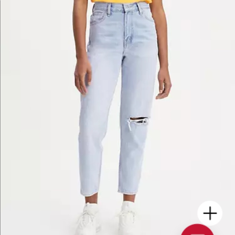 light blue ripped mom jeans levi’s